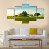 A beautiful golf course in Philippines during sunset Multi Panel Canvas Wall Art