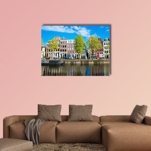 View of the ancient buildings, streets, people, embankments of Amsterdam multi panel canvas wall art