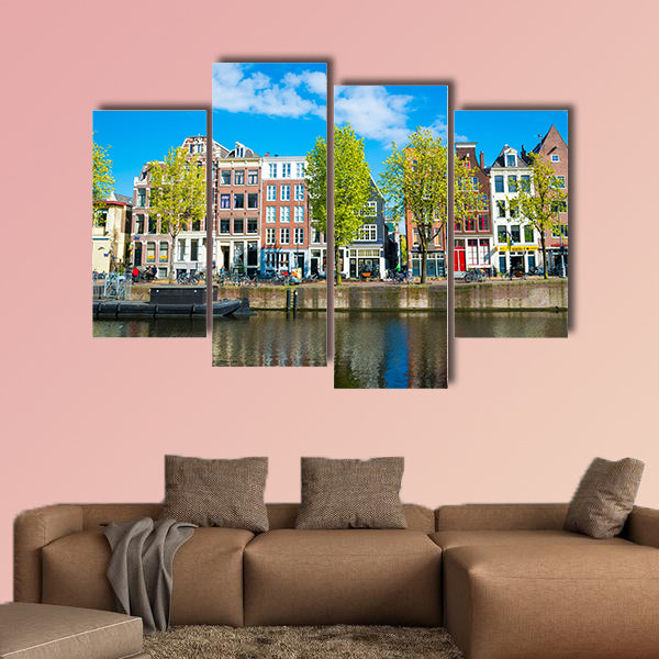 View of the ancient buildings, streets, people, embankments of Amsterdam multi panel canvas wall art