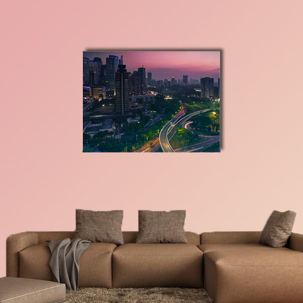 Aerial view of office building with highway junction multi panel canvas wall art
