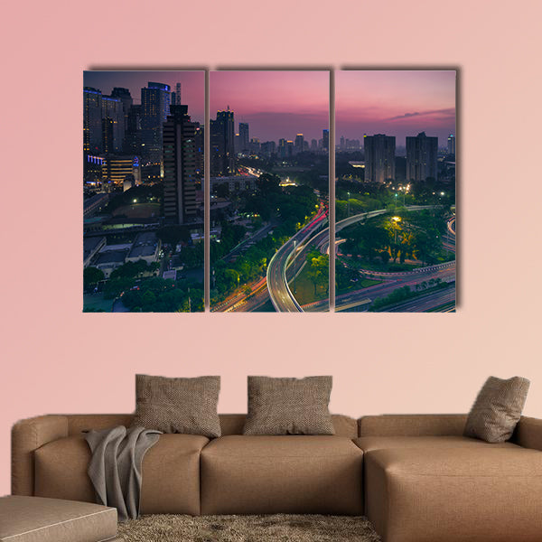 Aerial view of office building with highway junction multi panel canvas wall art
