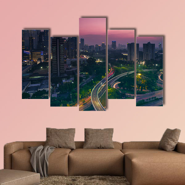Aerial view of office building with highway junction multi panel canvas wall art