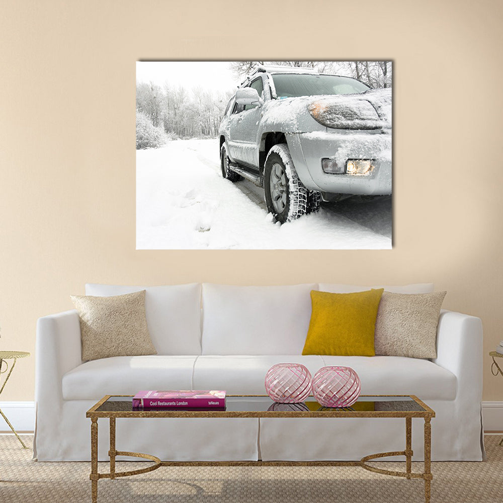 Snowy winter road behind an unrecognizable car Multi panel canvas wall art