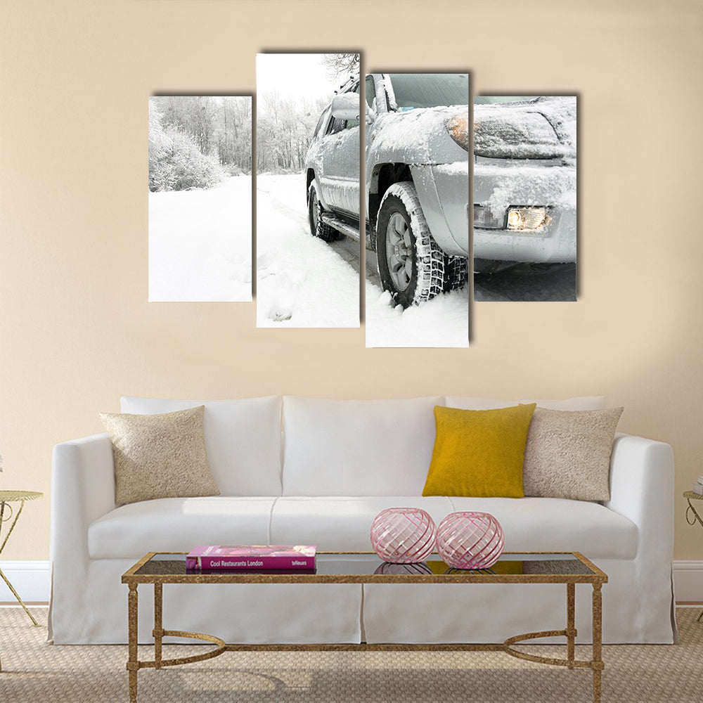 Snowy winter road behind an unrecognizable car Multi panel canvas wall art