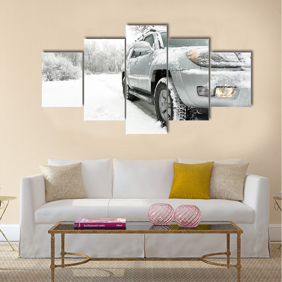 Snowy winter road behind an unrecognizable car Multi panel canvas wall art