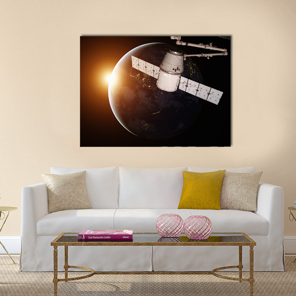 Satellite orbiting the planet Earth Multi Panel Canvas Wall Art