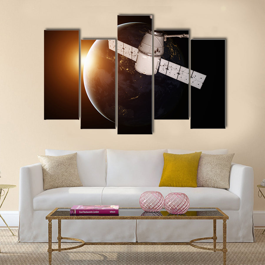 Satellite orbiting the planet Earth Multi Panel Canvas Wall Art