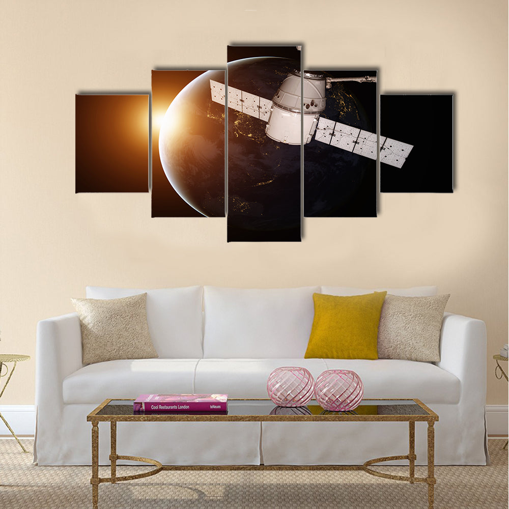 Satellite orbiting the planet Earth Multi Panel Canvas Wall Art