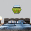 Green meadow with hay rolls hexagonal canvas wall art