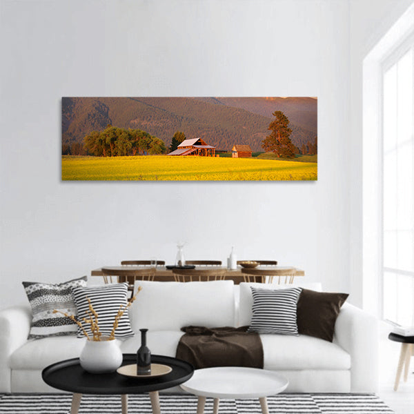 Rapeseed farm and barn in evening sun light Panoramic Canvas Wall Art