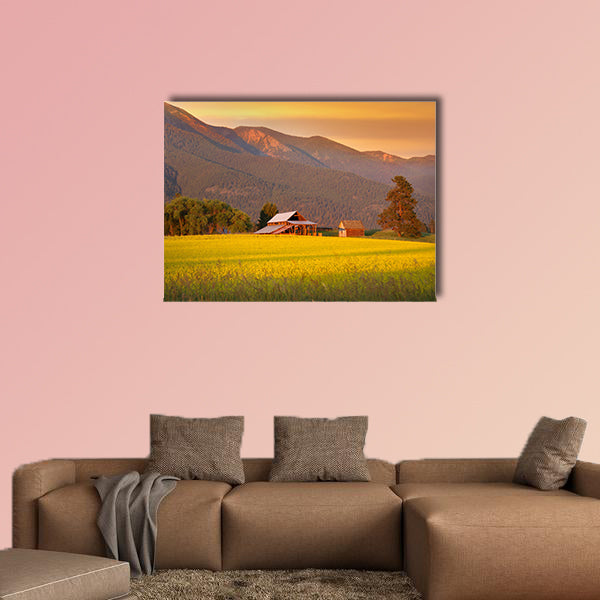 Rapeseed farm and barn in evening sun light Multi panel canvas wall art