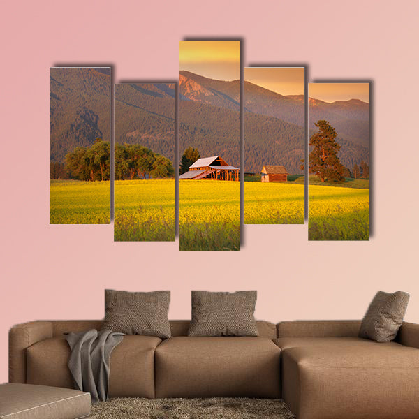 Rapeseed farm and barn in evening sun light Multi panel canvas wall art