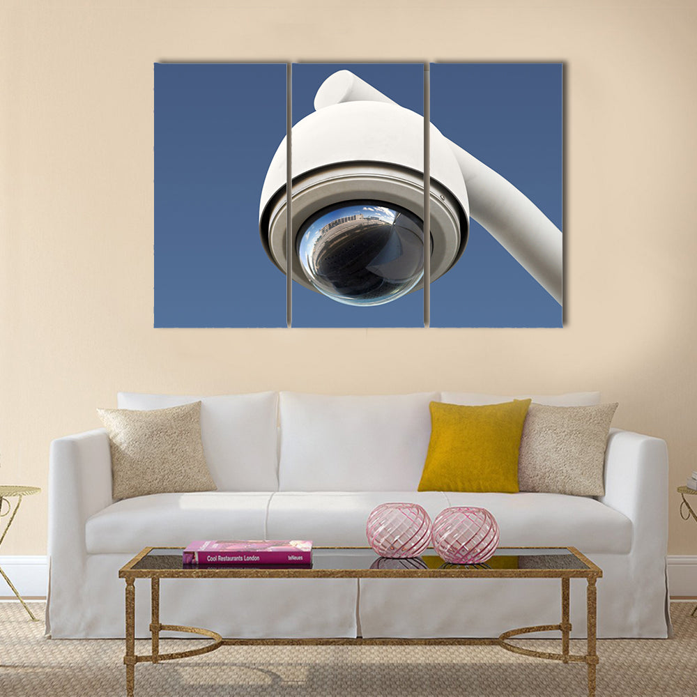High tech overhead security camera with a gradient blue sky Multi panel canvas wall art