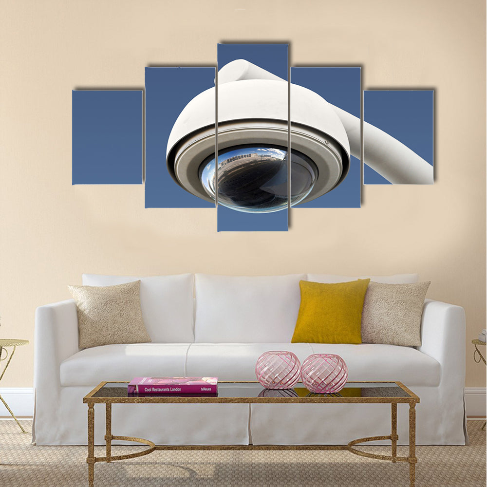 High tech overhead security camera with a gradient blue sky Multi panel canvas wall art