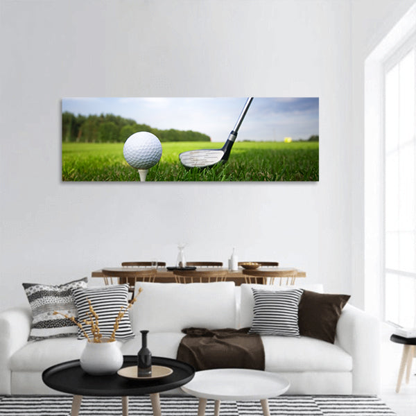 Playing golf. Golf club and ball. Preparing to shot Panoramic Canvas Wall Art