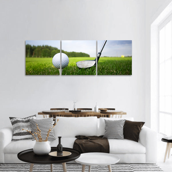 Playing golf. Golf club and ball. Preparing to shot Panoramic Canvas Wall Art