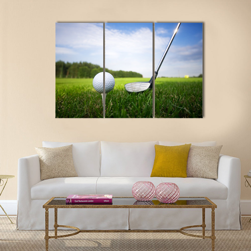 Playing golf. Golf club and ball. Preparing to shot Multi Panel Canvas Wall Art