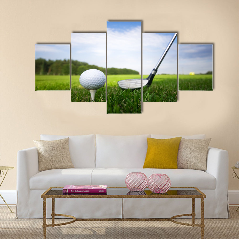 Playing golf. Golf club and ball. Preparing to shot Multi Panel Canvas Wall Art