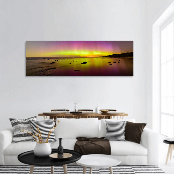 Intense northern lights over Baltic sea. rocky beach panoramic canvas wall art