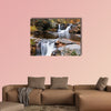 Waterfall with trees and rocks in mountain in autumn multi panel canvas wall art