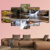 Waterfall with trees and rocks in mountain in autumn multi panel canvas wall art