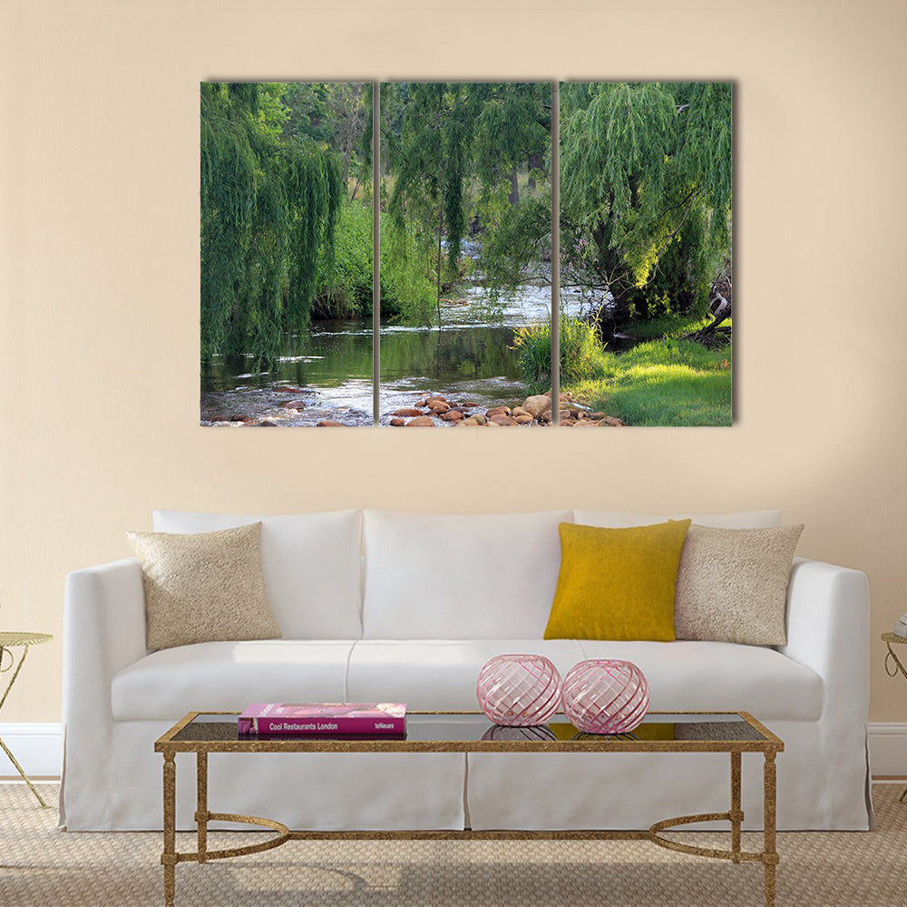 River flowing past willow trees Multi Panel Canvas Wall Art