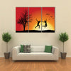 man and girl holding hands and jumping on hill near bare tree, orange background multi panel canvas wall art