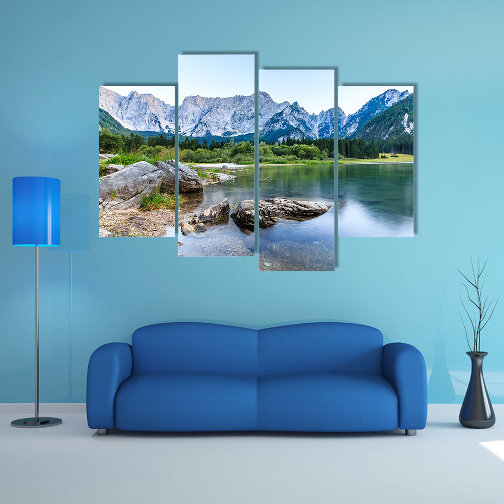 The sun goes down in front of Mount Mangart in the Italian Alps multi panel canvas wall art