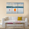 One seagull bird standing resting on an orange buoy multi panel canvas wall art