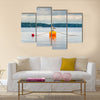 One seagull bird standing resting on an orange buoy multi panel canvas wall art