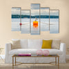 One seagull bird standing resting on an orange buoy multi panel canvas wall art