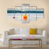 One seagull bird standing resting on an orange buoy multi panel canvas wall art