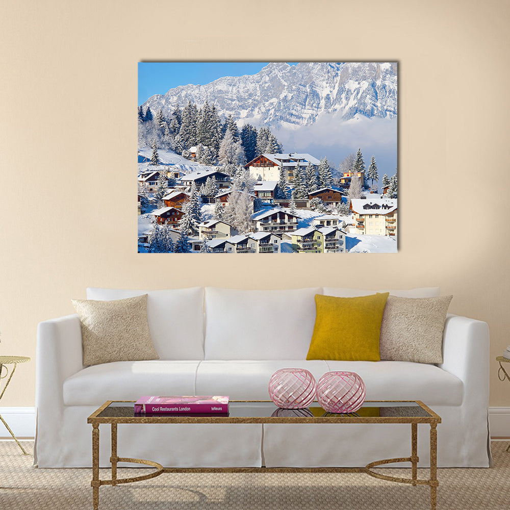Winter holiday houses in swiss alps multi panel canvas wall art