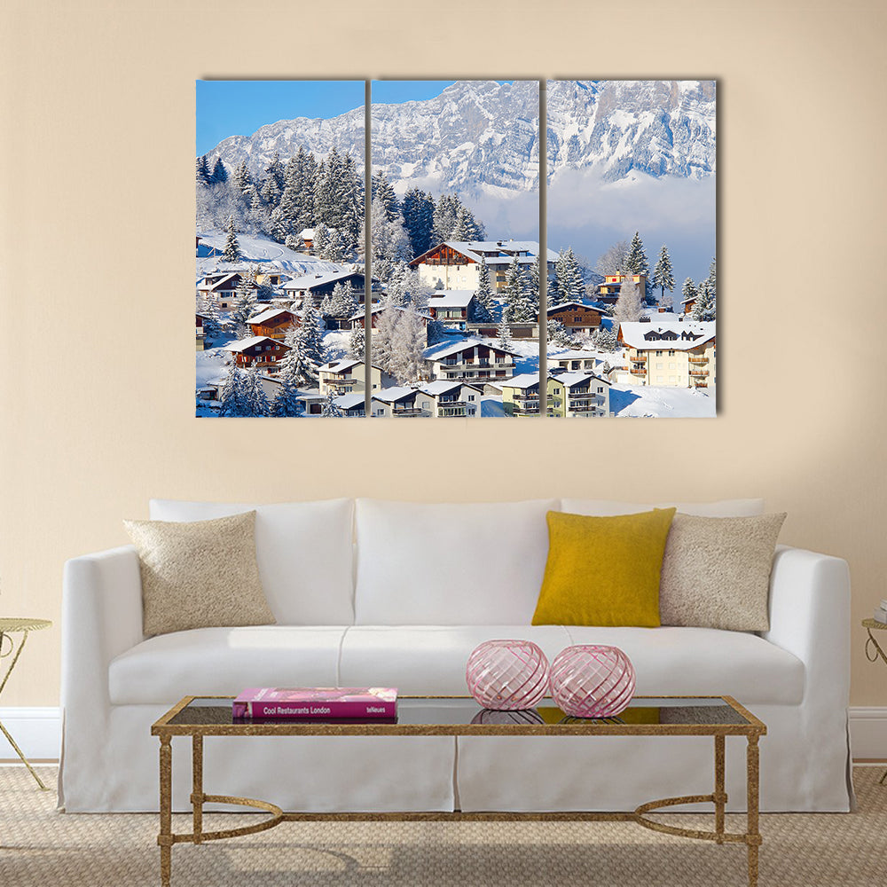 Winter holiday houses in swiss alps multi panel canvas wall art