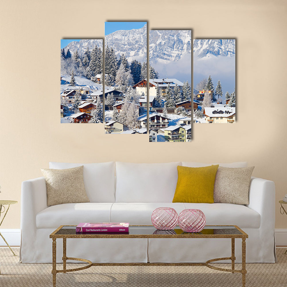 Winter holiday houses in swiss alps multi panel canvas wall art