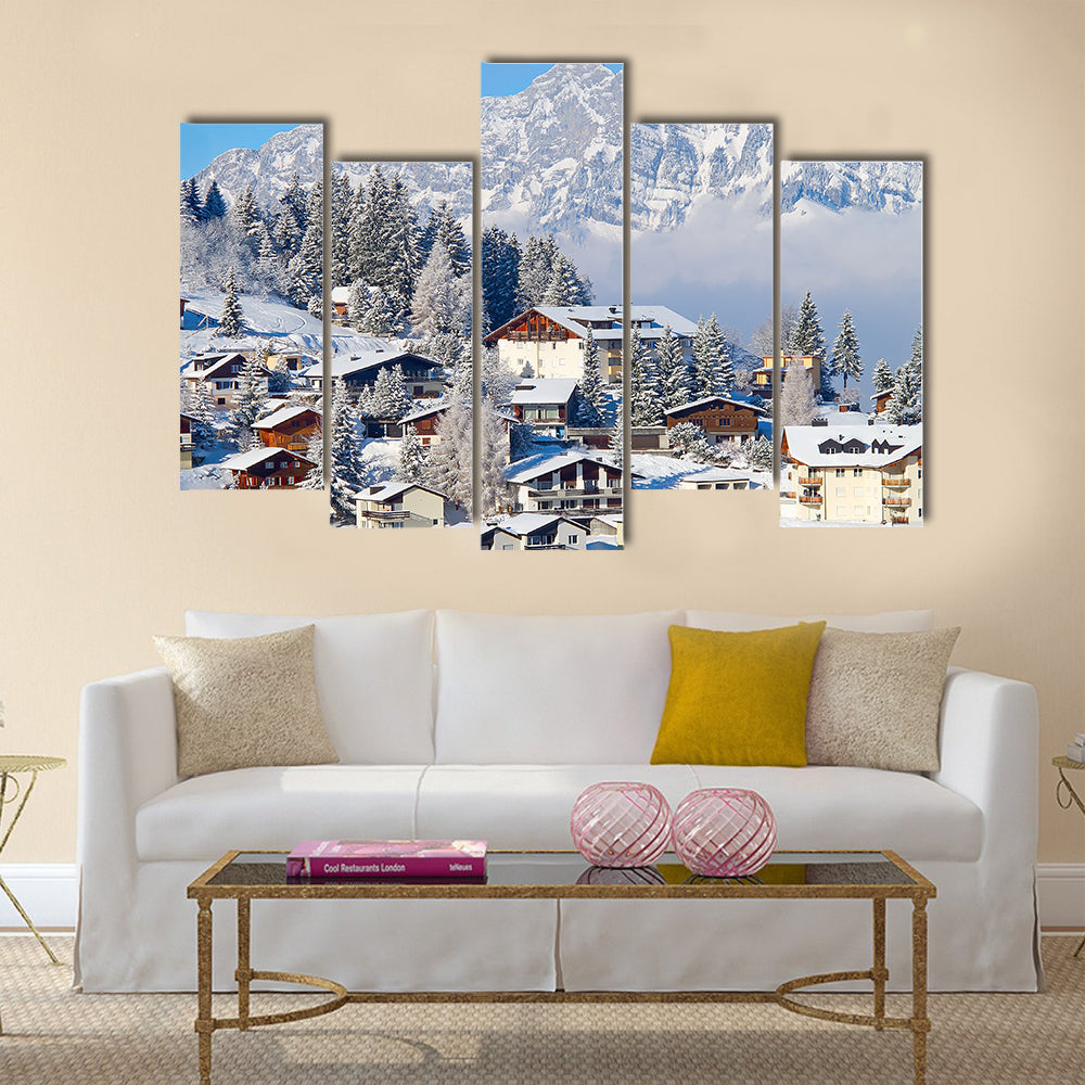 Winter holiday houses in swiss alps multi panel canvas wall art