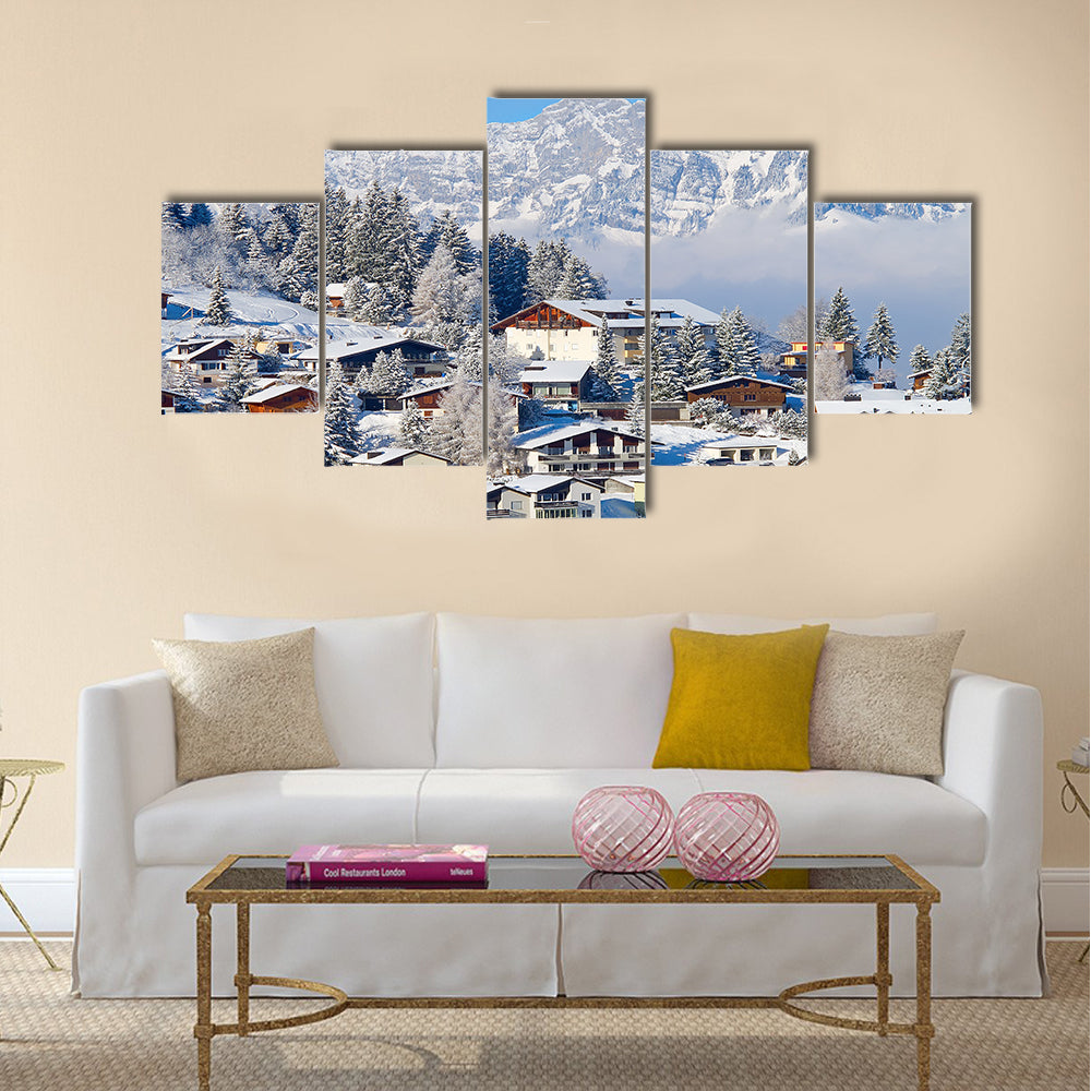 Winter holiday houses in swiss alps multi panel canvas wall art