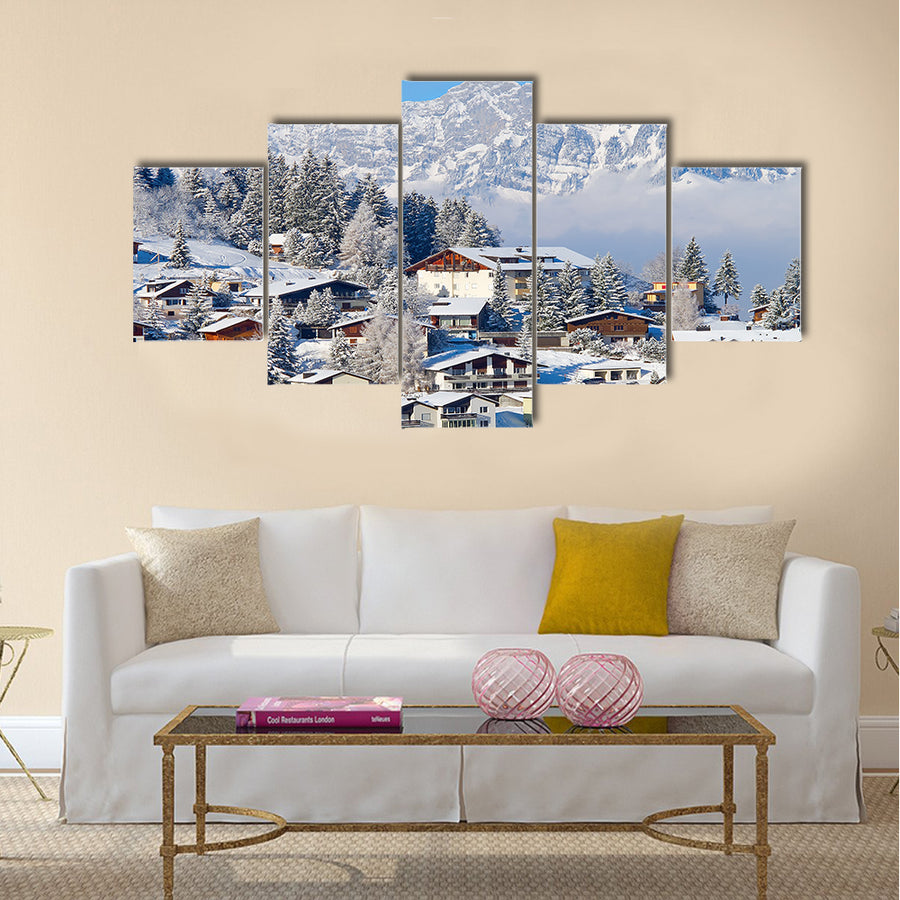 Winter holiday houses in swiss alps multi panel canvas wall art