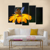 Blue butterfly on yellow flower Multi Panel Canvas Wall Art