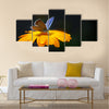 Blue butterfly on yellow flower Multi Panel Canvas Wall Art