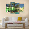 Luxurious tropical vegetation on wasteland later in the day Multi Panel canvas wall art