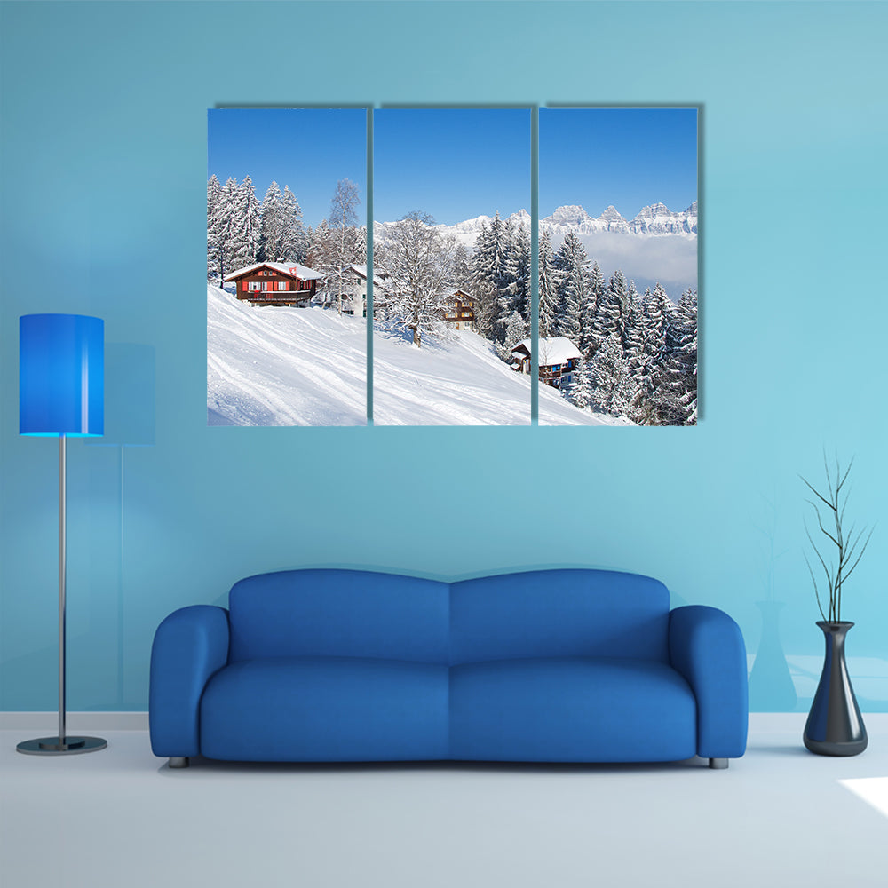 The Winter holiday house in Swiss alps Multi Panel Canvas Wall Art
