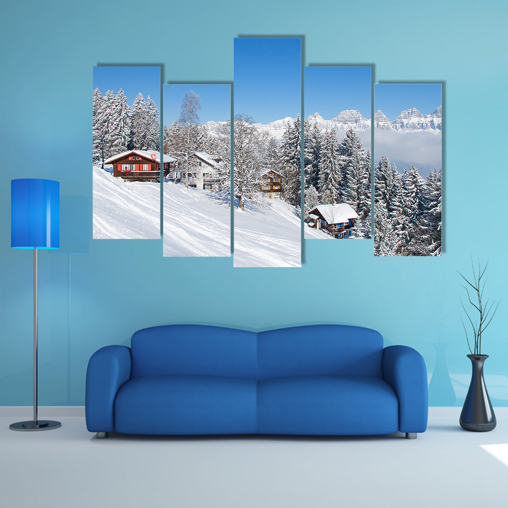 The Winter holiday house in Swiss alps Multi Panel Canvas Wall Art