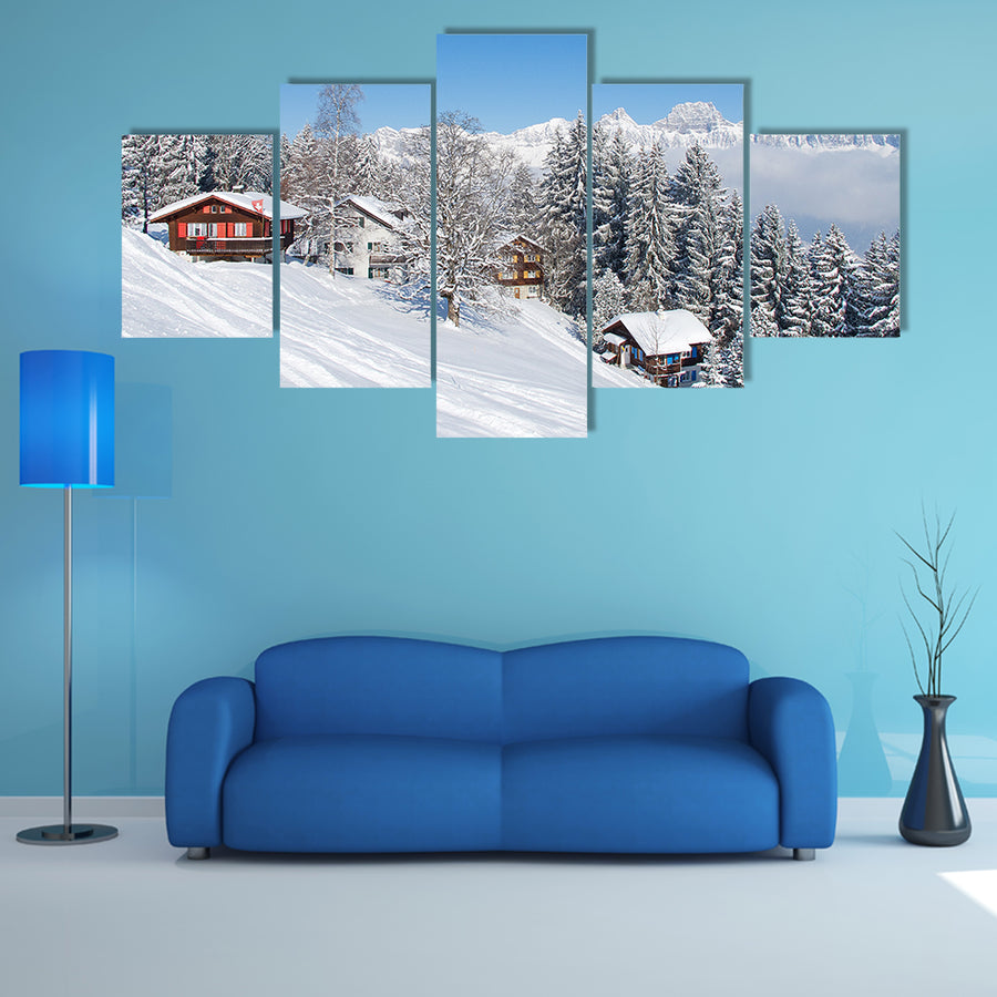 The Winter holiday house in Swiss alps Multi Panel Canvas Wall Art