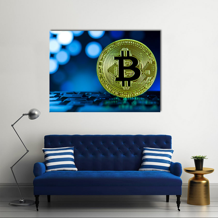 Golden bitcoin on keyboard against digital blue multi panel canvas wall art