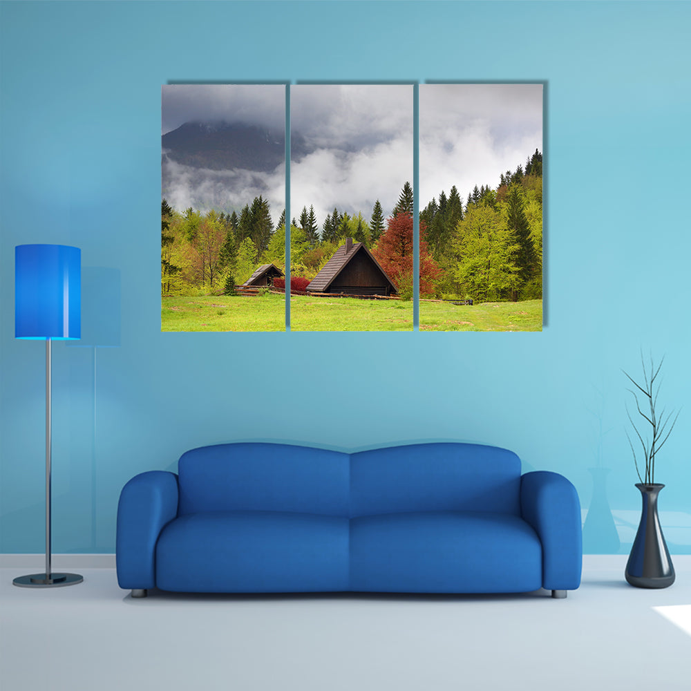 Mountain alps landscape with house and trees in fog clouds in Slovenia at spring multi panel canvas wall art
