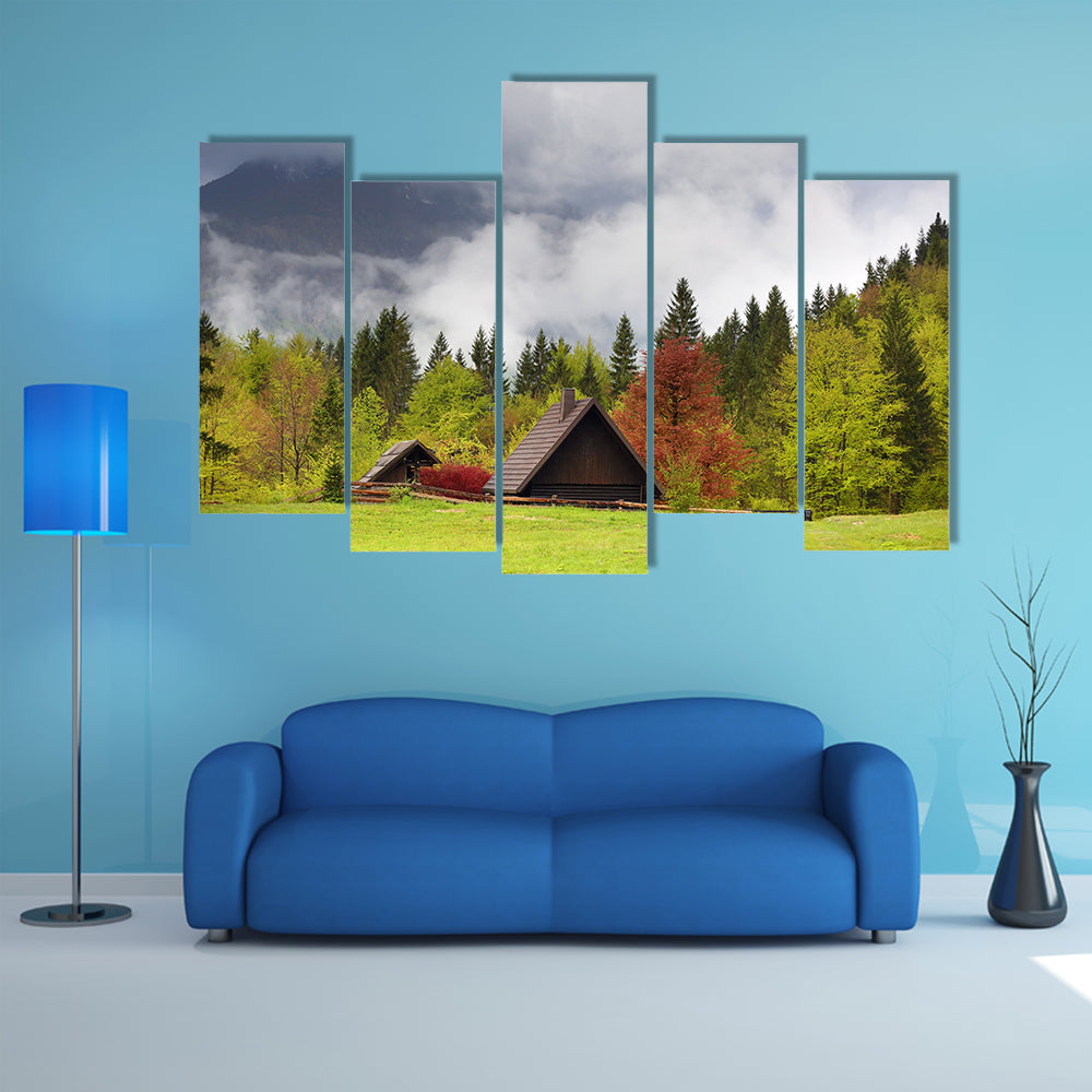 Mountain alps landscape with house and trees in fog clouds in Slovenia at spring multi panel canvas wall art