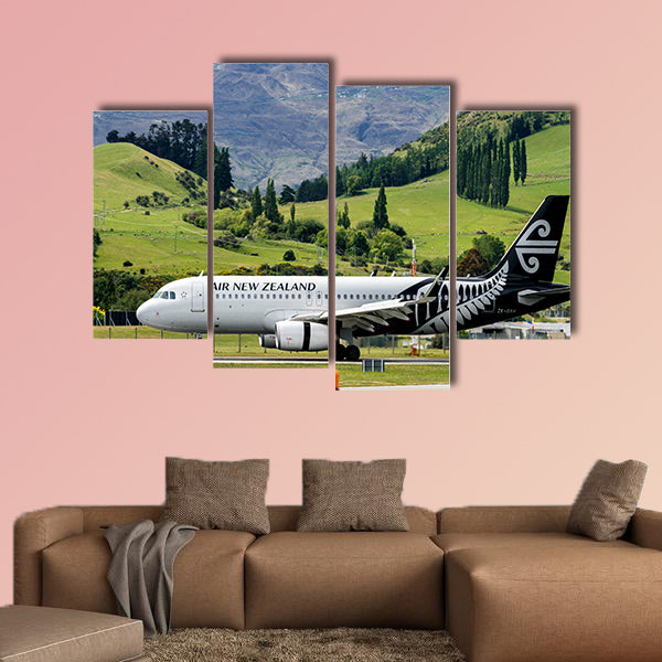 Airplane of Air New Zealand takes off from runway canvas wall art