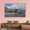 Seascape with Red tower and castle wall of Alanya shot on cloudy day multi panel canvas wall art