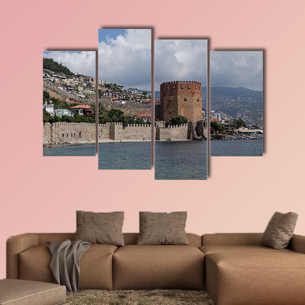 Seascape with Red tower and castle wall of Alanya shot on cloudy day multi panel canvas wall art